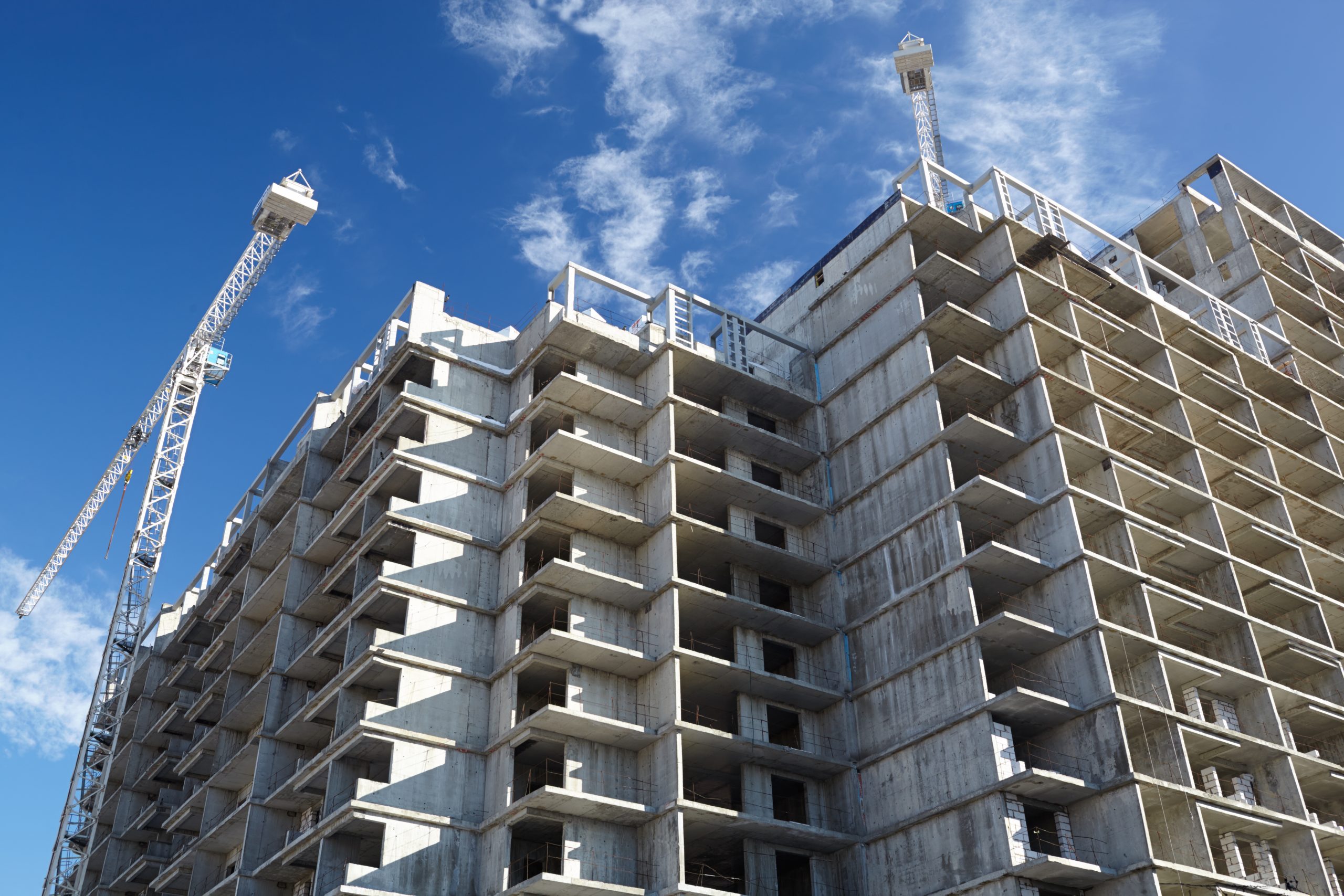 Construction of building. Beautiful sky background.